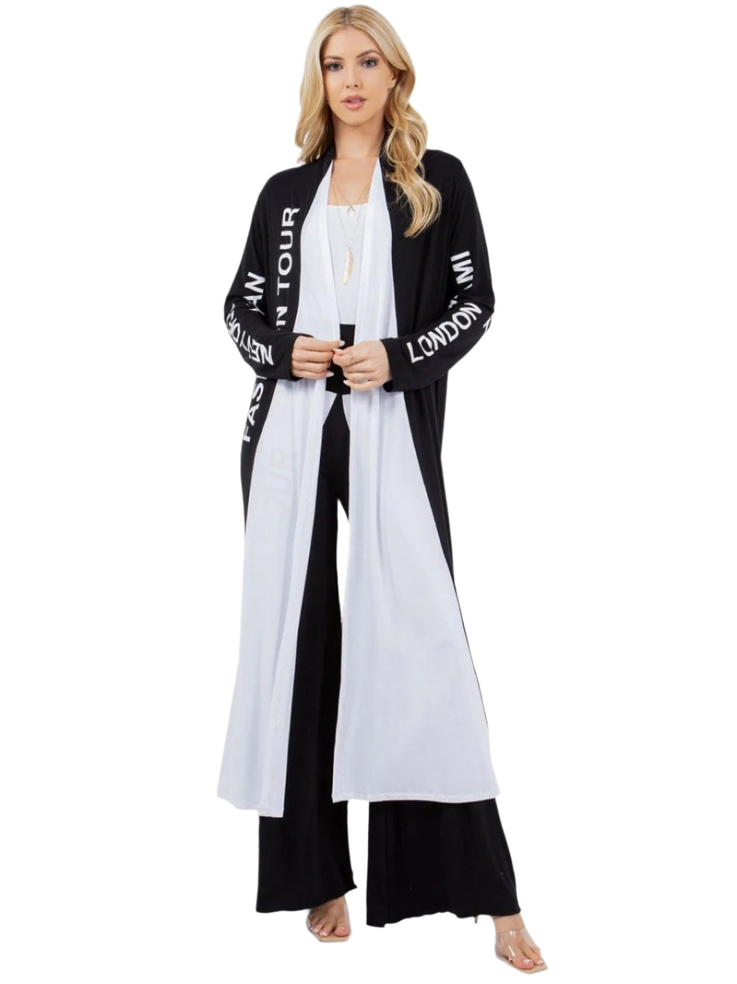 Woman wearing a black and white outfit with text on a white background
