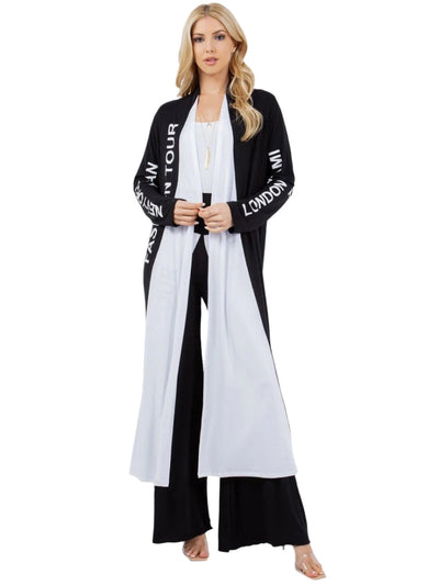 Woman wearing a black and white outfit with text on a white background