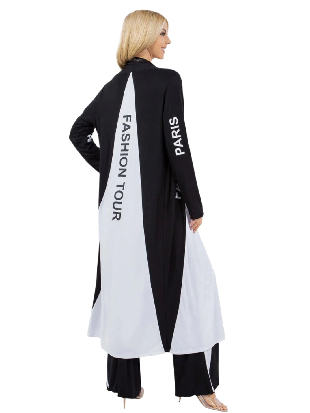 Woman wearing a black and white outfit with 'Fashion Tour Paris' text on a white background