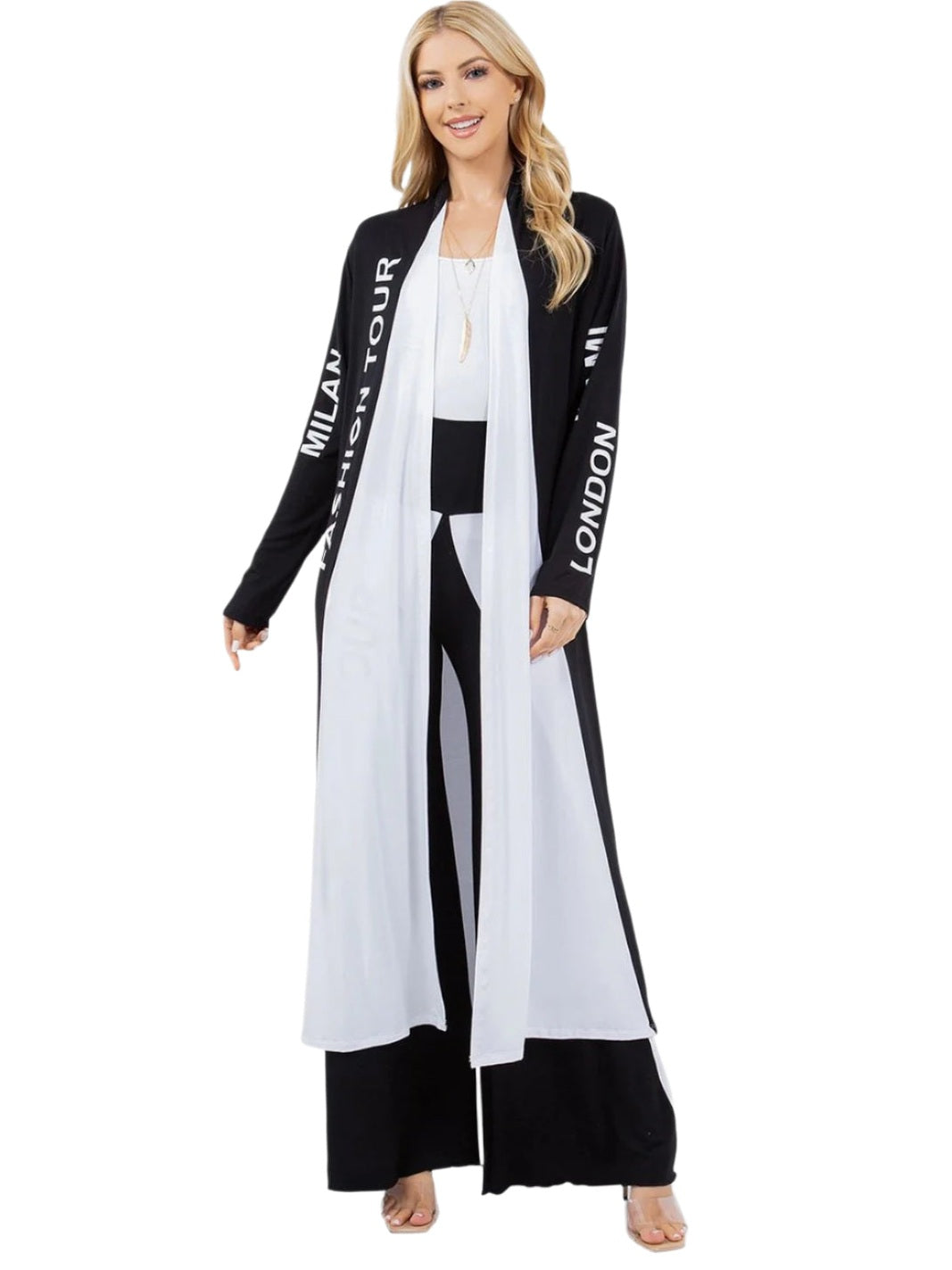 Woman wearing a black and white outfit with 'Milan' and 'London' text on a white background