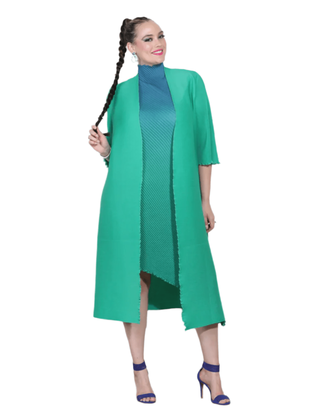 Woman wearing a green dress with a matching long coat against a white background