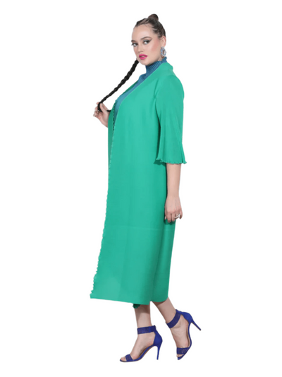 Woman wearing a green dress with a white background